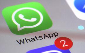FILE - This March 10, 2017 file photo shows the WhatsApp communications app on a smartphone, in New York. Ireland's privacy watchdog said Thursday Sept. 2, 2021, it has fined WhatsApp a record 225 million euros ($267 million) after an investigation found it breached stringent European Union data protection rules on transparency about sharing people's data with other Facebook companies. (AP Photo/Patrick Sison, File)
