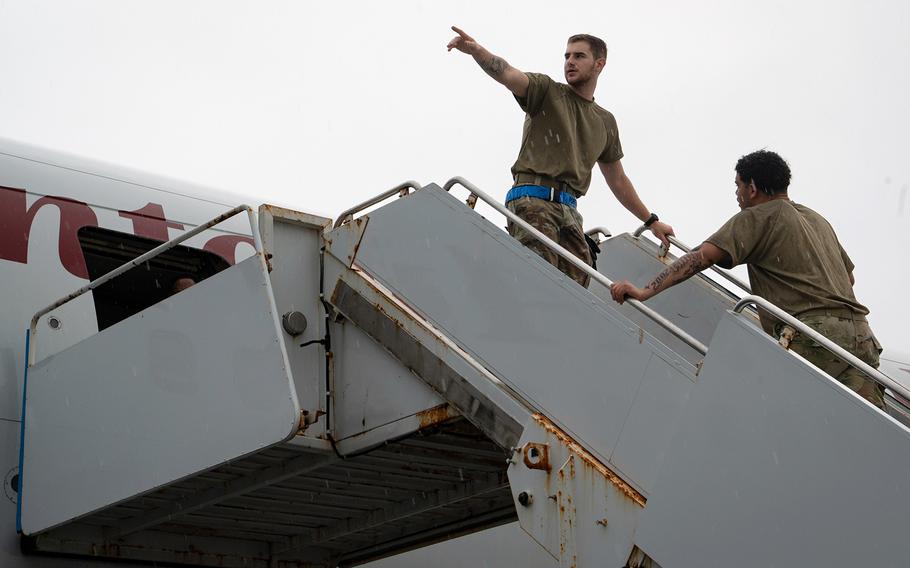 Members of the 734th Air Mobility Squadron prepare the Patriot Express for departure at Andersen Air Force Base, Guam, May 30, 2023.