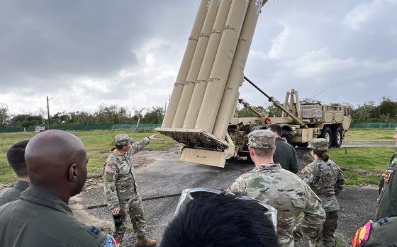 U.S. Army Capt. Riley Campbell points out the components of the Terminal High Altitude Area Defense, or THAAD, system to airmen visiting the battery in Guam on Feb. 23, 2024.
