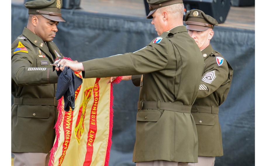 Army Col. Reginald Evans, Fort Eisenhower garrison commander, left, and Command Sgt. Maj. Aaron Rose unveil the new garrison colors for the Augusta, Ga., installation during a renaming ceremony Friday, Oct. 27, 2023. The former Fort Gordon was the last of nine Army bases to be renamed this year to drop their former names honoring Confederate generals.