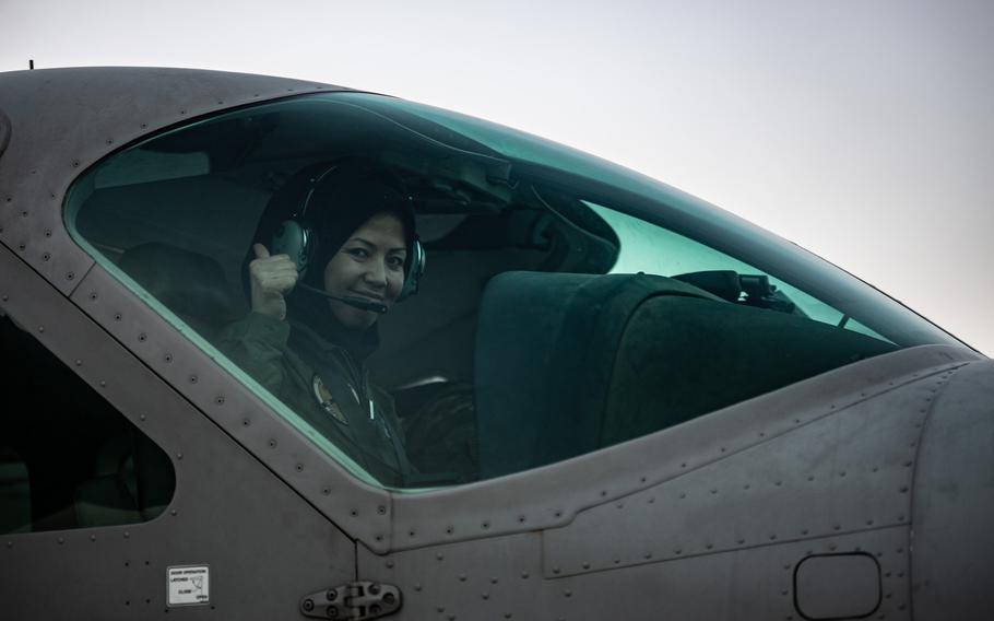Afghan air force Capt. Safia Ferozi gives a thumbs-up from the cockpit of her aircraft during a preflight check in Kabul, Afghanistan, in 2017. 