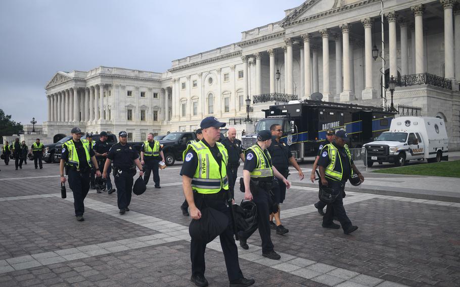 Capitol Police officers prepare for the “Justice for J6” rally in Washington on Sept. 18.