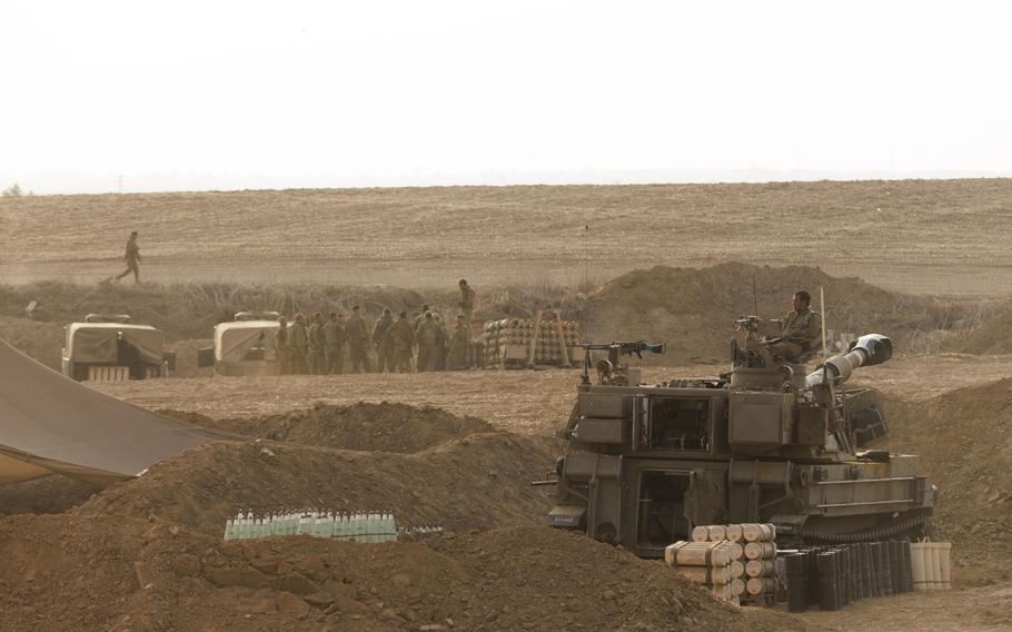 An Israeli army mobile howitzer dug in near the border with the Gaza Strip outside Kibbutz Be’eri in southern Israel, on Oct. 22, 2023.