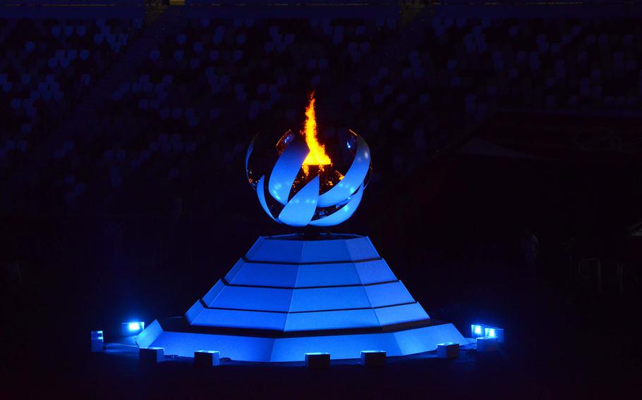 The Olympic flame burns inside the new National Stadium ahead of the Tokyo games' closing ceremony, Sunday, Aug. 8, 2021.