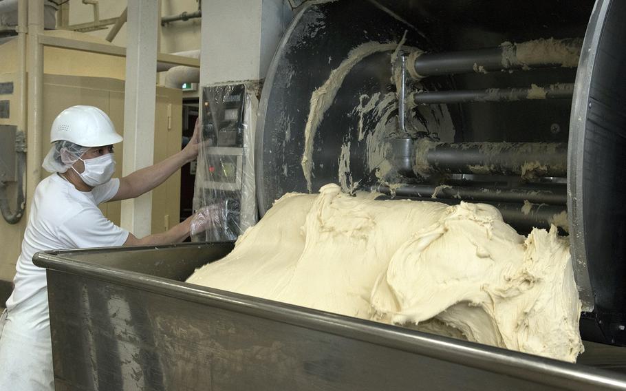 Jyunichiro Nakata prepares dough at the Yokota Bakery Plant on Yokota Air Base, Japan, Tuesday, April 19, 2022.