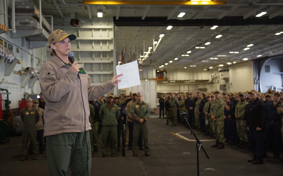 Capt. Amy Bauernschmidt, commanding officer of the aircraft carrier USS Abraham Lincoln, talks to sailors Dec. 30, 2022. Bauernschmidt, the first woman ever to command a Navy aircraft carrier, recently was slated for promotion to one-star rear admiral.