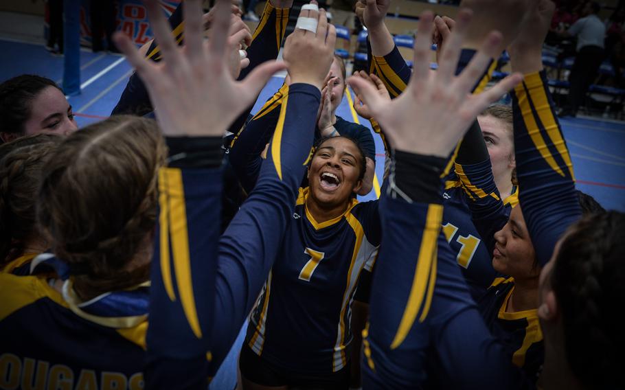 Kalea Russell, center, celebrates with her teammates after the Ansbach Cougars won the 2022 DODEA-Europe Division III Volleyball Tournament Oct. 29, 2022, at Ramstein Air Base, Germany. 