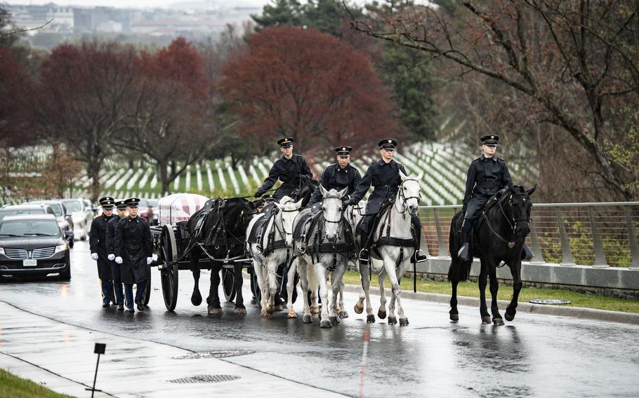 Soldiers from the 3rd U.S. Infantry Regiment, Caisson Platoon, and the U.S. Army Band conduct military funeral honors with a funeral escort at Arlington National Cemetery, Va., on March 24, 2023. 