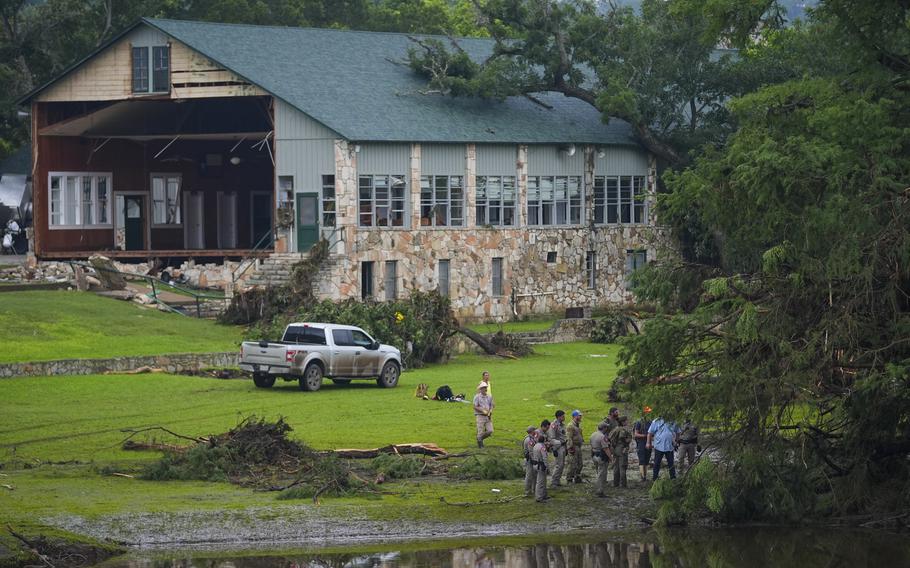 Officials search on the grounds of Camp Mystic