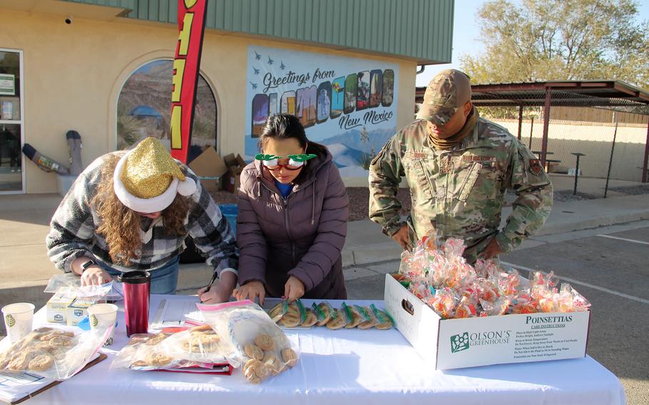 Hannah McCormick, Sarah Marshall and Sterling Wynn process cookie donations on Dec. 6, 2021, at the Alamogordo Center of Commerce for the Holloman AFB Airmen Cookie Drive. The Holloman AFB Airmen Cookie Drive provides cookies to Airmen staying in the base dorms through the holidays.