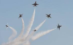 Six fighter jets split off in different directions.