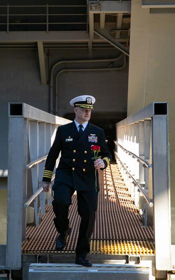 Capt. Richard Burgess, commanding officer of the USS Gerald R. Ford, walks off the ship upon returning from an eight-month deployment, Wednesday, Jan. 17, 2024.