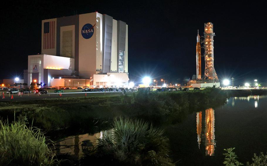 Artemis I leaves the Vehicle Assembly Building as it rolls out to launch pad 39-B at Kennedy Space Center, Florida, Tuesday, Aug. 16, 2022. The rocket is scheduled to launch on an unmanned mission to orbit the moon on Aug. 29. 