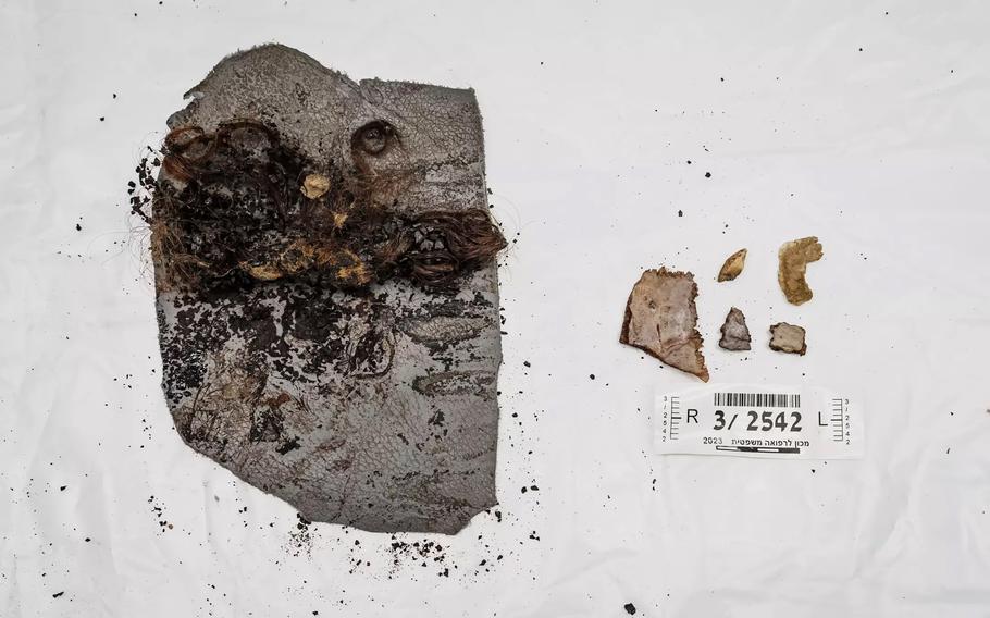 Part of a human skull and hair attached to vehicle upholstery, left, and skull fragments recovered after Hamas’ Oct. 7 assault in Israel.