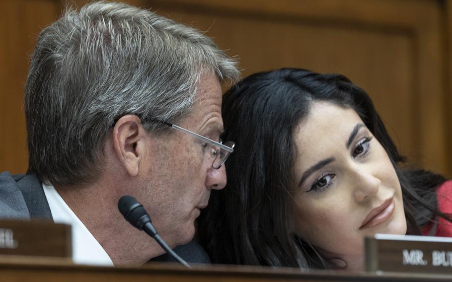 Rep. Tim Burchett, R-Tenn., confers with Rep. Anna Paulina Luna, R-Fla., before a House Oversight subcommittee hearing on Unidentified Anomalous Phenomena, July 26, 2023, on Capitol Hill.