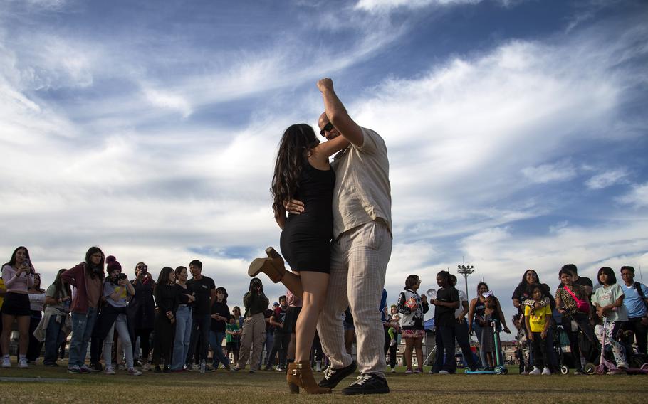 Yarelis Coss and Aaron Ferguson perform a dance demonstration during a Hispanic Heritage Month celebration at Marine Corps Air Station Iwakuni, Japan, Oct. 13, 2023.