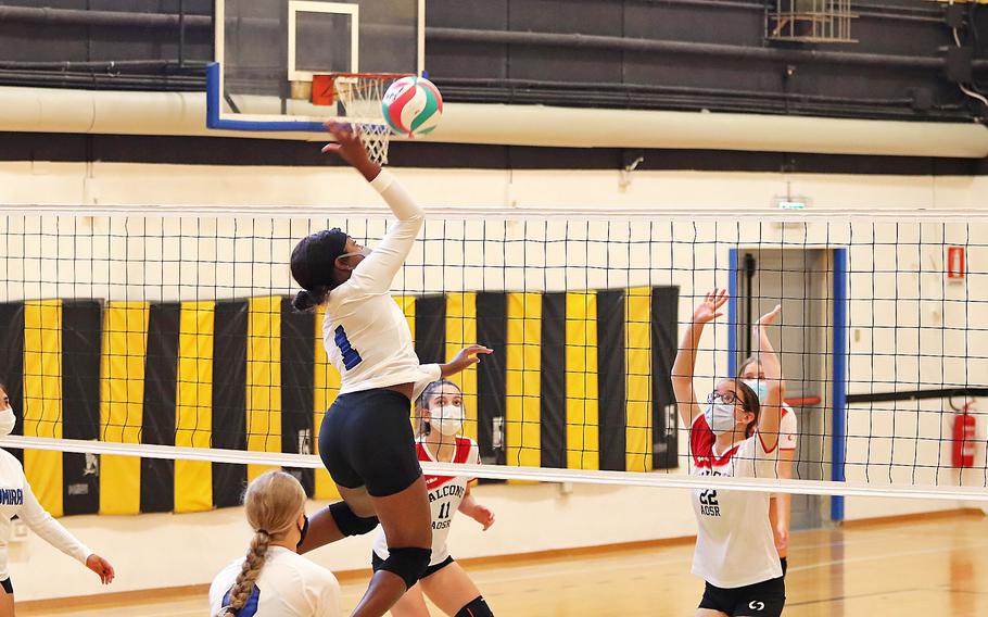 Rota's Brianna Leiba goes up for a kill with Caitlin Duggan of American School of Rome trying to block during the DODEA-Europe Division II tournament in Vicenza, Italy.