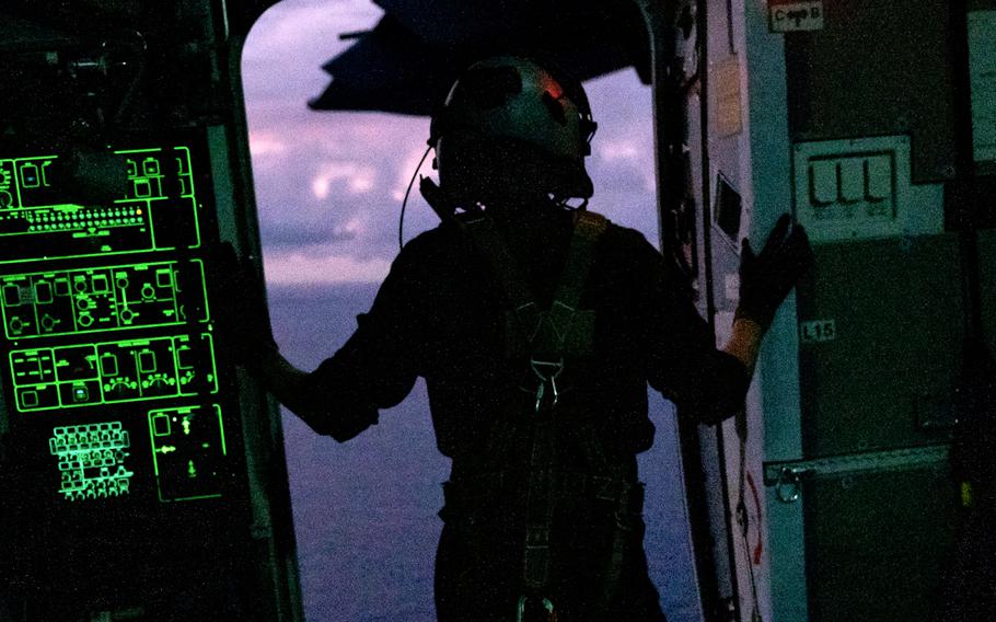 A French airman scans the Pacific Ocean for a disabled ship near the Northern Marianas, July 10, 2023.