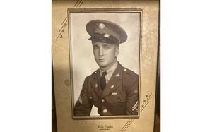 A picture of a framed black and white portrait.