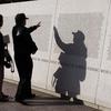 Hed: Japanese American Memorial, 2008

Washington, D.C., Nov. 11, 2008: Lynn Bettancourt helps her father, Grant Hirabayashi, find his cousin's name at the Japanese American Memorial to Patriotism during World War II. 

About 33,000 Japanese Americans served in the U.S. military during World War II. Of those, 812 lost their lives. Their names are inscribed on the wall of the memorial. 

Mr. Hirabayashi himself served as a tech sergeant in the 5307 Composite Unit, also known as Merrill’s Marauders, in China, Burma and India.

Read the full story here. https://www.stripes.com/news/2008-11-12/veterans-day-2008-ceremonies-in-washington-honor-servicemembers-sacrifices-1986933.html1

META TAGS: Japanese Americans; World War II; veterans; Asian Americans; Pacific Americans; 