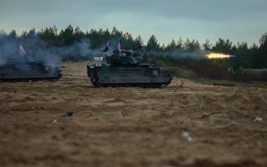 Soldiers from 2nd Armored Brigade Combat Team, 3rd Infantry Division, fire missiles during exercise Iron Spear in Adazi, Latvia, Nov. 13, 2023. Since Russia's initial invasion of Ukraine in 2014, NATO has added multinational battlegroups in the Baltics and Poland, and ramped up rotations of other combat forces in the region.