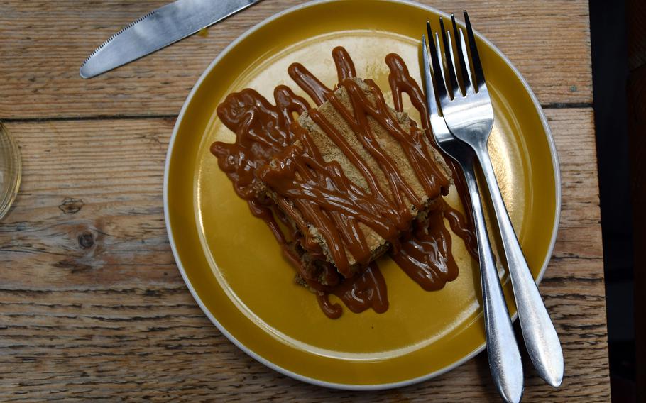 Coffee cake drizzled with arequipe sauce is one of the desserts served at La Latina Bustaurante in Cambridge, England. The restaurant offers Colombian cuisine, and the owners go to great lengths to ensure authenticity.