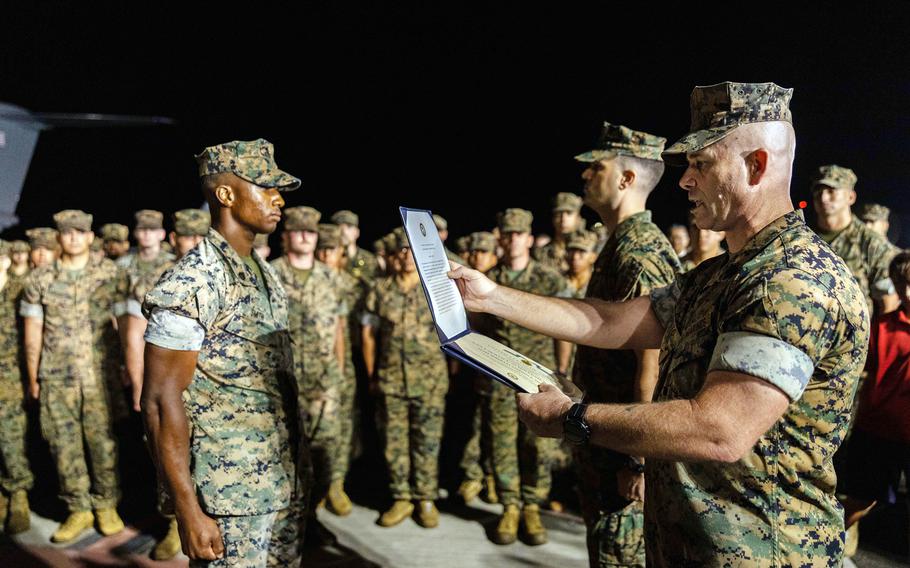 A Marine receiving an award.