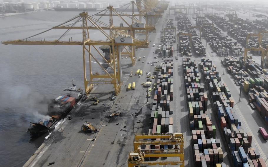 Smoke rises from the container ship Ocean Trader on Thursday, July 8, 2021 after there was an explosion on Wednesday night.   The blast, which sent a giant fireball skyward late Wednesday and shook homes and high-rises in several neighborhoods across Dubai, was powerful enough to be seen from space by satellite. 