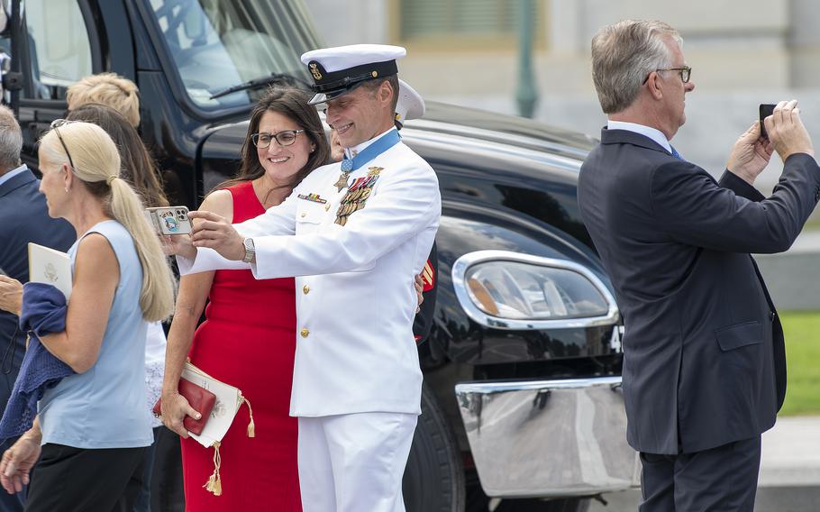 Medal of Honor recipient retired Navy SEAL Master Chief Petty Officer Britt Slabinski takes a selfie outside the U.S. Capitol in Washington on July 14, 2022, after attending a lying in honor ceremony for WWII MOH recipient Hershel Woodrow "Woody" Williams.