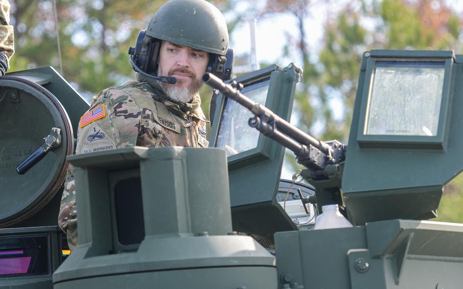 Jay Tenison, a former Army tanker who served in Iraq, enters an M1A2 Abrams tank at Fort Moore, Ga., on Dec. 5, 2023, before shooting the tank as his dying wish. Tenison was diagnosed in 2022 with terminal stomach cancer.