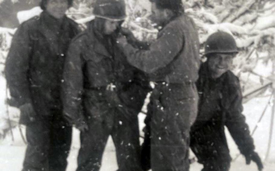 U.S. soldiers horse around in the snow in this undated image from the Korean War. 