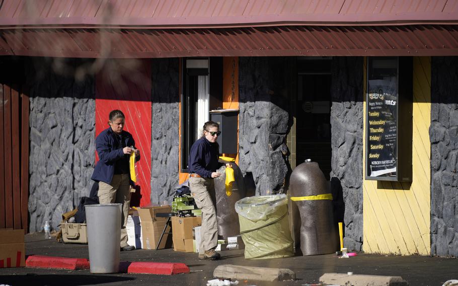 Law enforcement investigators enter Club Q, the site of a weekend mass shooting, on Tuesday, Nov. 22, 2022, in Colorado Springs, Colo.  