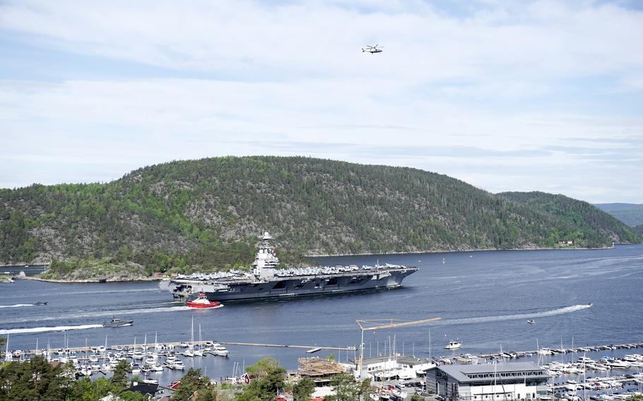 The aircraft carrier USS Gerald R. Ford passes on its way to the Oslo Fjord, at Drobak, Norway, Wednesday, May 24, 2023. The ship is the world's largest warship and will be in port of Oslo for four days. 