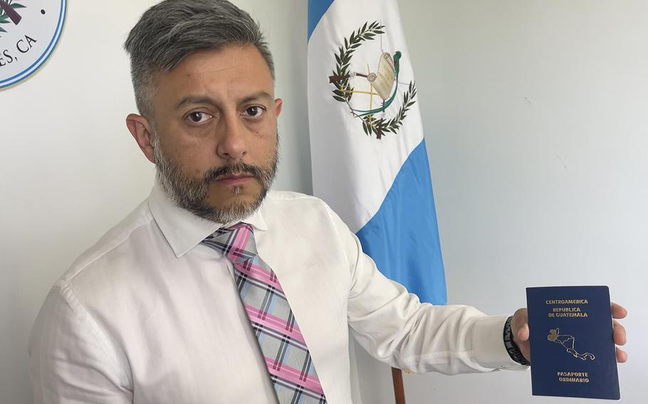 Ángel Salazar, the Guatemalan consul in Los Angeles, shows a passport waiting to be sent to a Guatemalan citizen living in Southern California. 