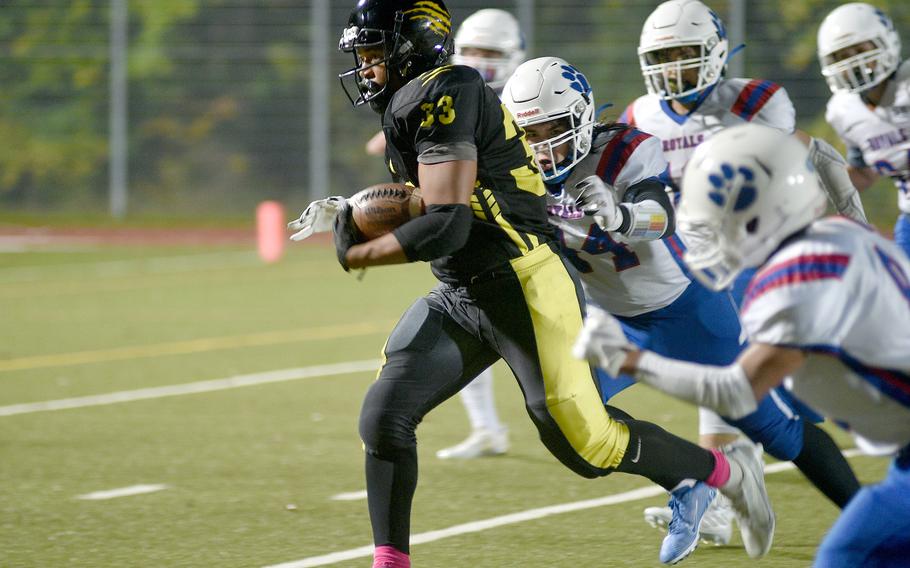 Stuttgart’s Trenton Jackson outruns a host of Ramstein defenders during a DODEA-Europe Division I semifinal in Stuttgart, Germany.