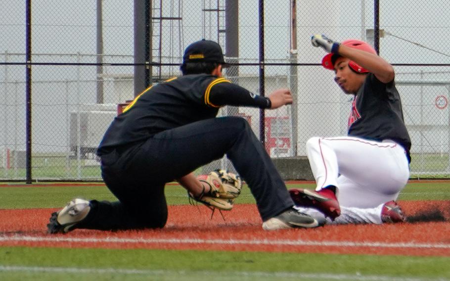 Kadena's Adam Santana applies the tag to a sliding Arashi Blocton of Kinnick.
