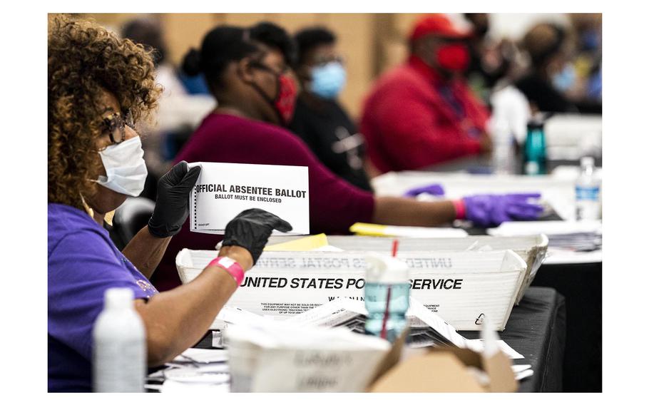 Ballots are processed at the Elections Preparation Center at State Farm Arena in Atlanta on Nov. 3, 2020. 