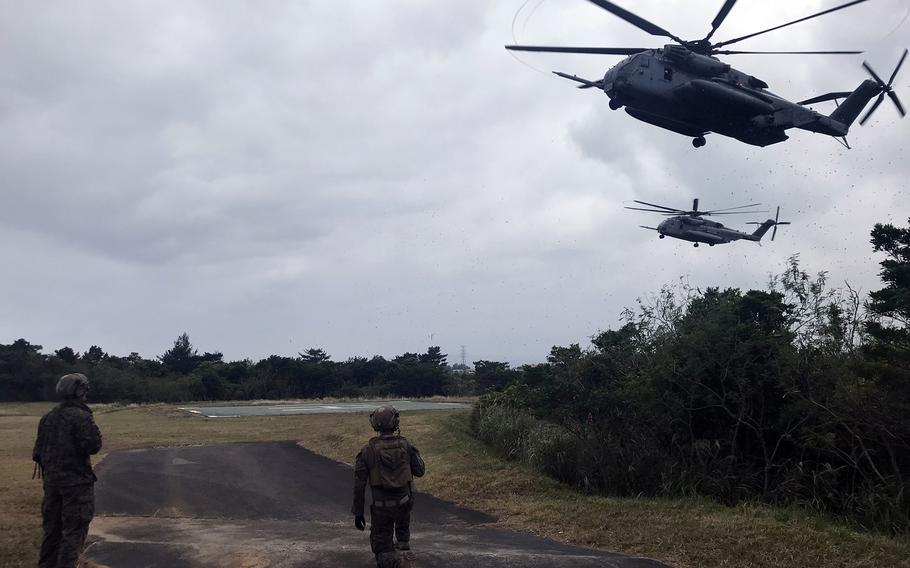 A pair of CH-53 Super Stallions arrive at Camp Schwab, Okinawa, Feb. 14, 2023, to ferry Marines to the Northern Training Area. 