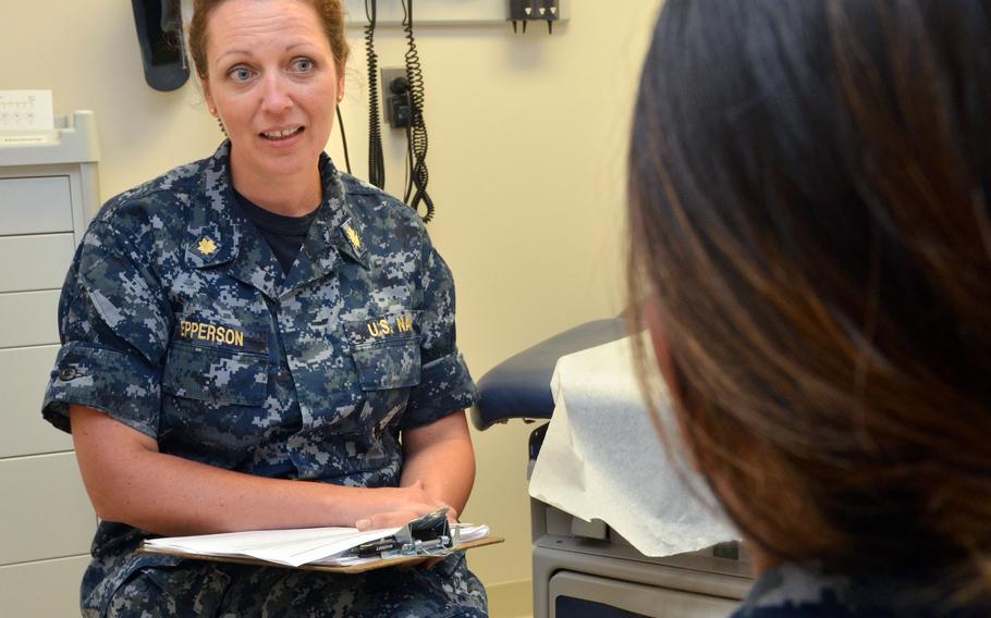 Lt. Cmdr. Brandi Epperson, a nurse practitioner at Naval Hospital Jacksonville, Fla., discusses sexual health with a patient in 2017. Annual chlamydia incidence rates grew by 67% for active-duty service members from 2013 to 2019, according to an Armed Forces Health Surveillance Division report. The rate fell more recently, which researchers attribute to less reporting during the coronavirus pandemic.