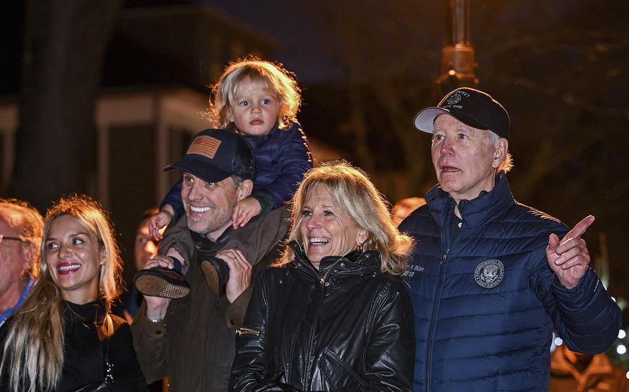 President Joe Biden watches a Christmas tree lighting ceremony with, from right, first lady Jill Biden, son Hunter Biden, grandson Beau, and daughter-in-law Melissa Cohen in Nantucket, Massachusetts, on Nov. 25, 2022. 