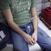 A patient is hooked up to an IV for a hangover treatment.