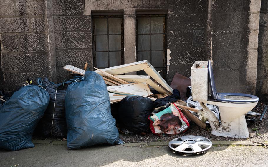 Garbage sits outside the Church of the Sacred Heart in Liege, Belgium, March 28, 2023.