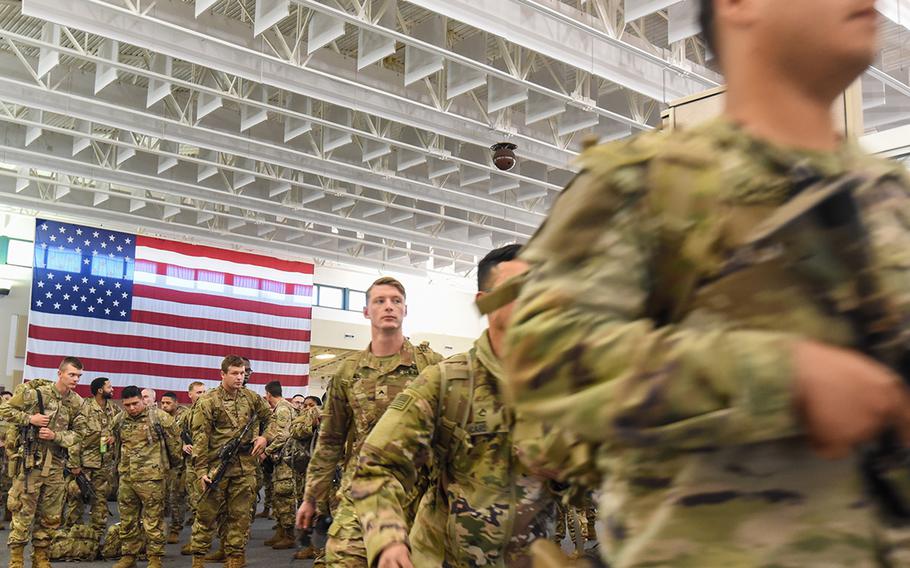
Fort Stewart soldiers with the 3rd Battalion, 69th Armored Regiment of the 3rd Infantry Division’s 1st Armored Brigade Combat Team prepare to board a flight bound for Germany out of Hunter Army Airfield, Ga., on Wednesday, March 2, 2022. The brigade was ordered to Europe on a short-notice deployment after Russia invaded Ukraine. 