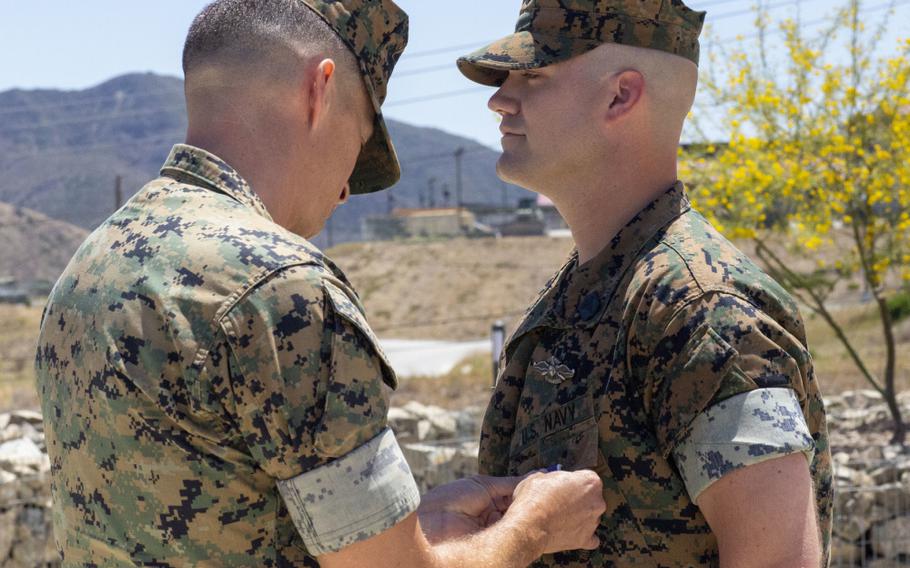 Lt. Col. Matthew T. Ritchie decorates Petty Officer 2nd Class Joseph Hardebeck with the Purple Heart Medal at Marine Corps Base Camp Pendleton, Calif., July 1, 2021. Hardebeck was awarded the Purple Heart for injuries sustained in support of Operation Enduring Freedom.