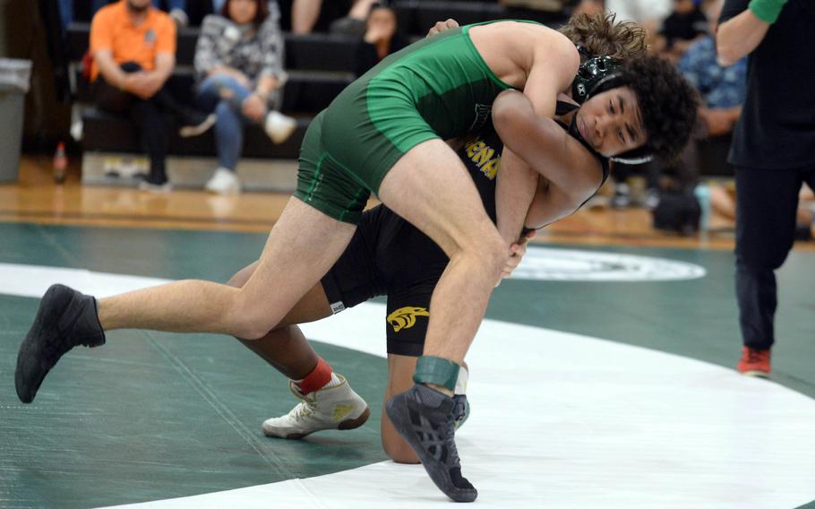 Kadena 127-pounder Josiah Drummer shoulder-throws Kubasaqki's Tim Cope during Wednesday's Okinawa wrestling dual meet. Drummer pinned Cope in 5 minutes, 32 seconds, and the Panthers won the meet 34-28 to go 4-0 over the Dragons on the season.