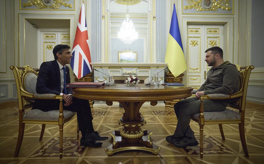 In this photo provided by the Ukrainian Presidential Press Office, Ukrainian President Volodymyr Zelenskyy, right, speaks with British Prime Minister Rishi Sunak during their meeting in Kyiv, Ukraine, Saturday, Nov. 19, 2022.