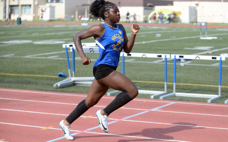 Yokota's Camielle Dixon leads the charge to the finsih of the 200-meter preliminaries.