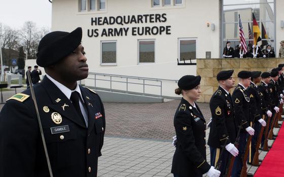 Soldiers stand in formation.