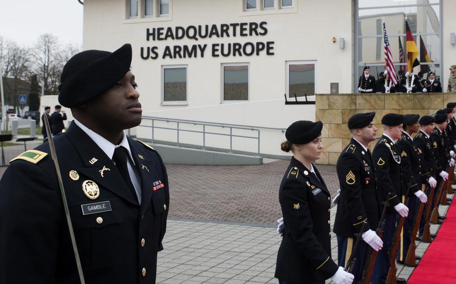 Soldiers stand in formation.
