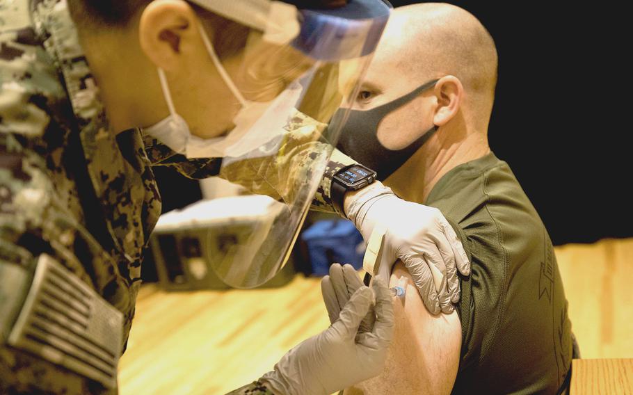 Col. Ray Gerber, commander of III Marine Expeditionary Force Information Group, receives the COVID-19 vaccine on Camp Hansen, Okinawa, Japan, Jan. 20, 2021.